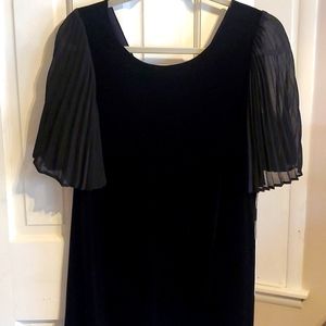 NWT black velvet dress. Just in time for the Holidays.  Sits above knee. Stretch